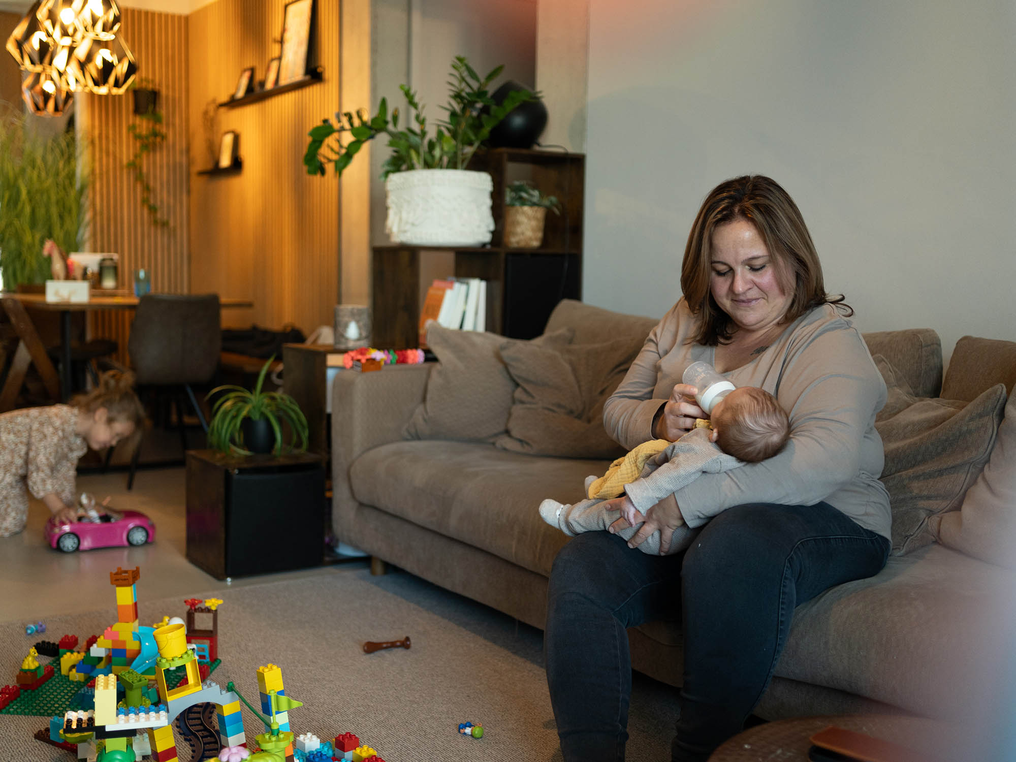 5 - Mirjam at home bottle-feeding an emergency foster baby - 90314889-c1f4-41c0-9501-f18bd.jpg